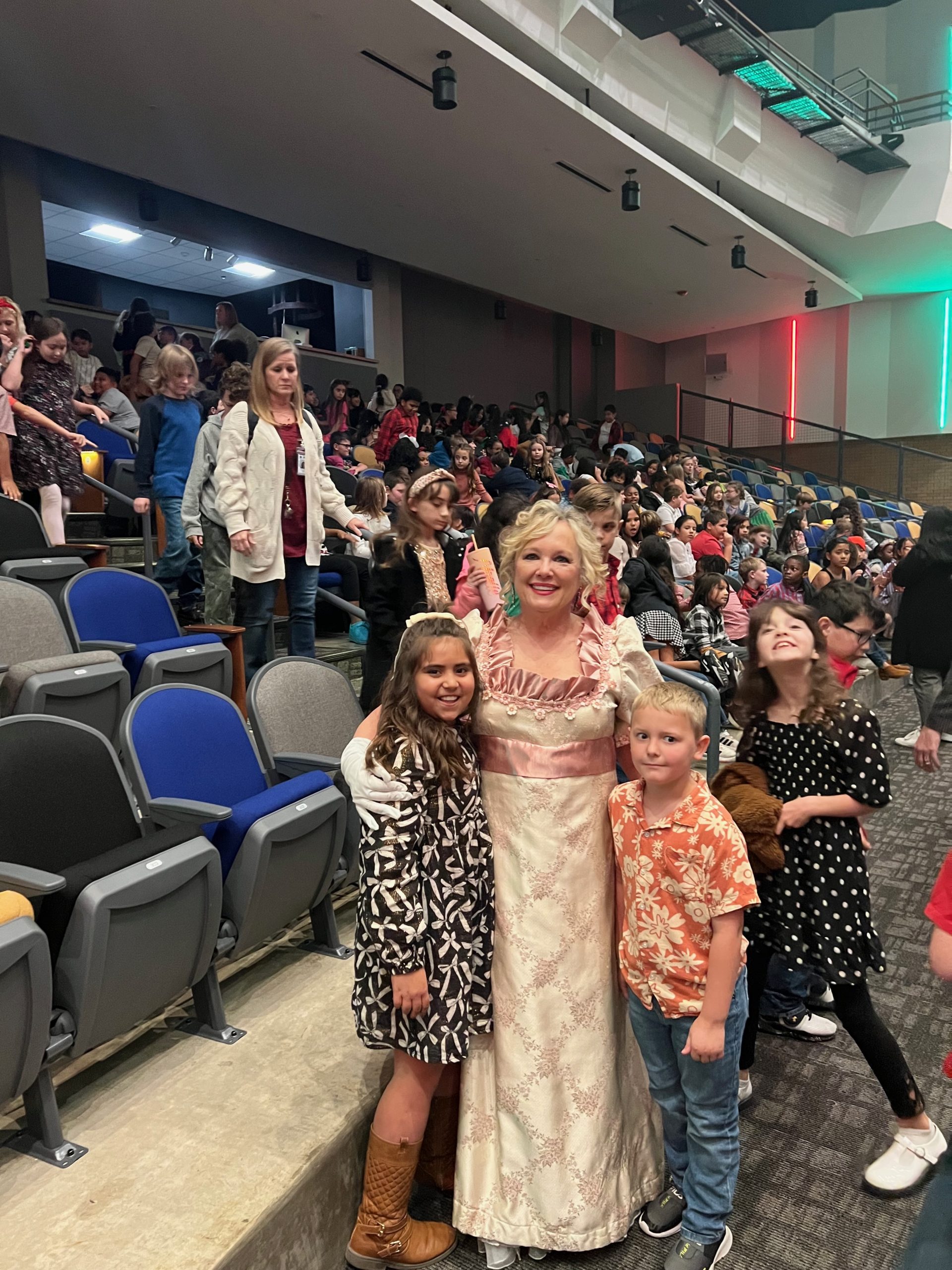 Family smiling together in the lobby before the show